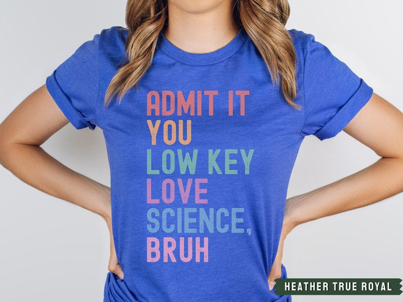 May include: A royal blue t-shirt with the text "ADMIT IT YOU LOW KEY LOVE SCIENCE, BRUH" in rainbow colors.