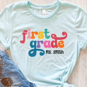 Custom First Grade Teacher Shirts, 1st Grade Personalized Teacher Name T-shirt, Back To School T-Shirt, Grade Level Elementary School Shirt