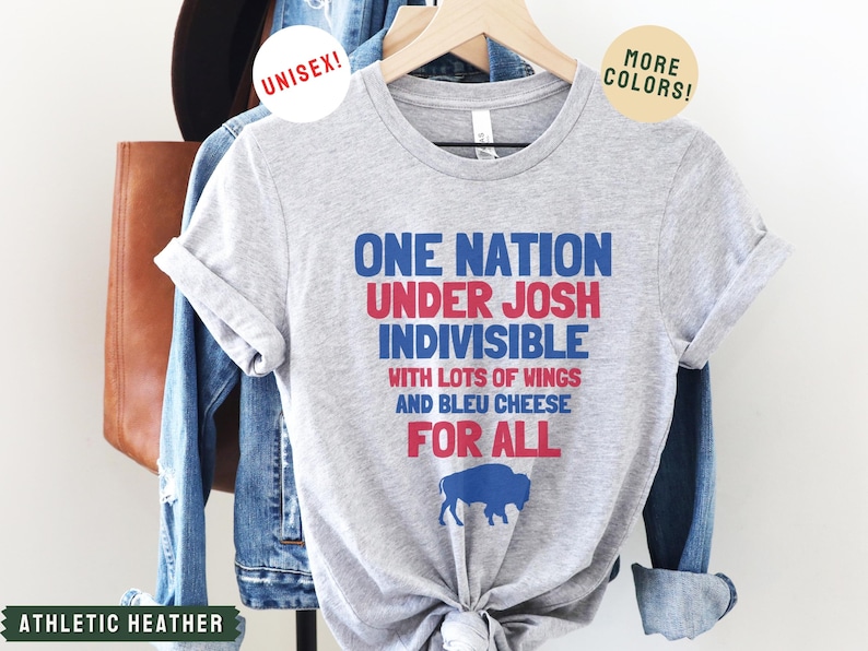 May include: A gray t-shirt with the text "One Nation Under Josh Indivisible with lots of wings and bleu cheese for all" in red, blue, and white. A blue buffalo silhouette is below the text.