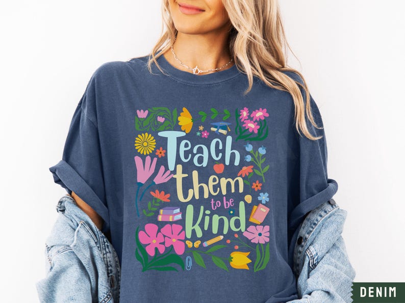 May include: A navy blue t-shirt with a floral design and the text "Teach them to be kind".