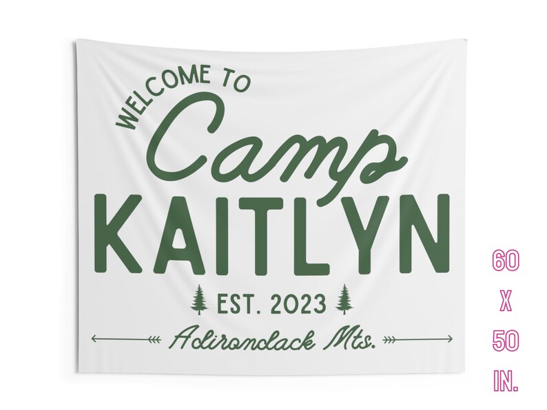 May include: White canvas wall tapestry with green text that reads "Welcome to Camp Kaitlyn Est. 2023 Adirondack Mts." The tapestry is 60 inches by 50 inches.