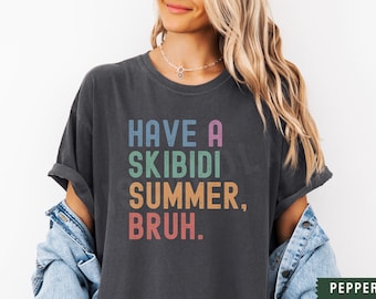 May include: A dark grey t-shirt with a colorful graphic that reads "Have a Skibidi Summer, Bruh."