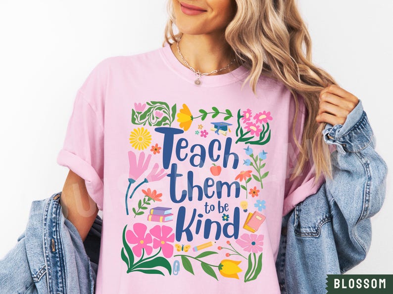 May include: Pink t-shirt with a floral design and the text "Teach them to be kind".