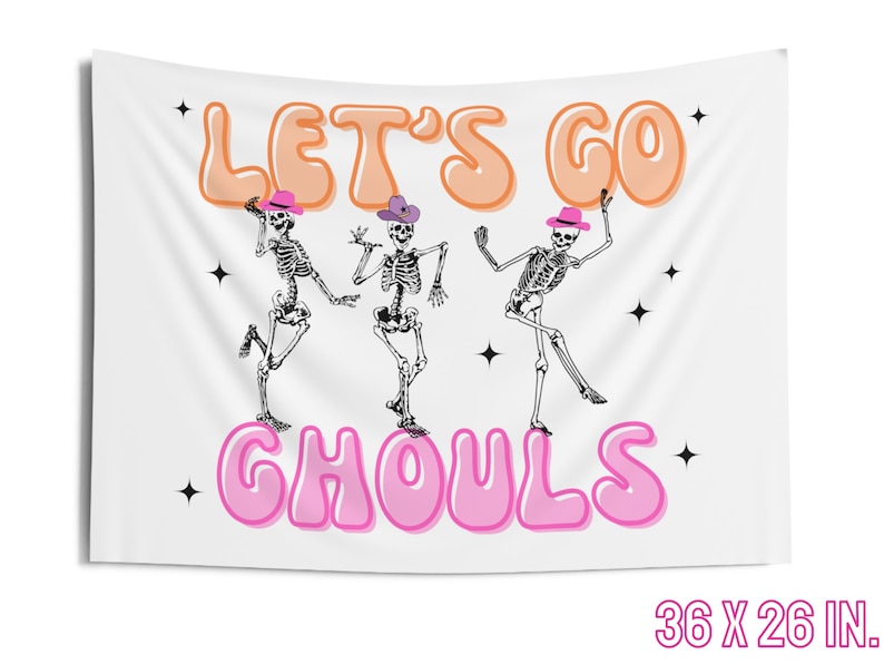 May include: White tapestry with the text "Let's Go Ghouls" in pink and orange bubble letters. Three skeletons wearing cowboy hats are dancing in front of the text. The tapestry is 36 inches by 26 inches.