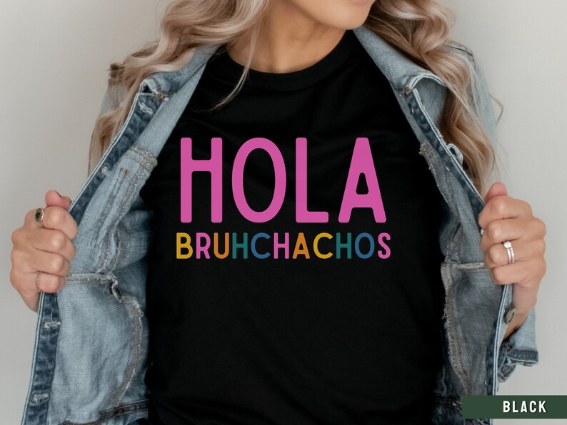 May include: Black t-shirt with the text "HOLA BRUHCHACHOS" in pink, yellow, green, blue, and orange letters.