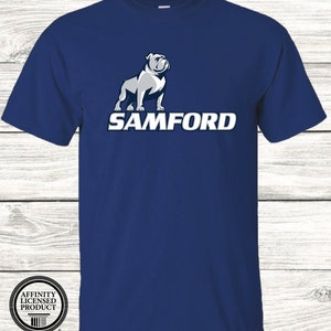 May include: A navy blue t-shirt featuring a white bulldog mascot and the word "SAMFORD" in white lettering.