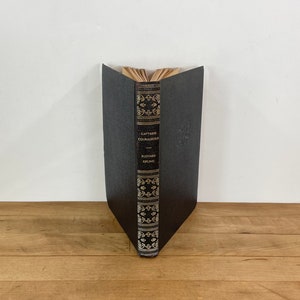 May include: A set of three ceramic vases in varying heights. The vases are white with a textured, ridged design. The tallest vase is approximately 10 inches tall, the medium vase is 8 inches, and the smallest is 6 inches.