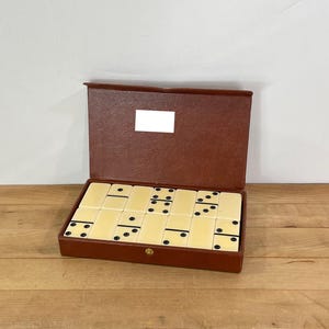 Puremco Style Plastic Ivory Dominoes with Black Dots, Full Set of 28 Standard Size Dominoes in a Brown Leather Case