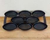 Antique 4 cast iron - 8 oval cup gem egg muffin pan. Excellent used condition.