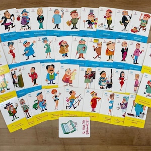 May include: A collection of vintage game cards featuring cartoon illustrations of various characters. The cards have blue and yellow borders with character names and the text "To Steal The Diamonds!". The cards are arranged on a wooden surface.