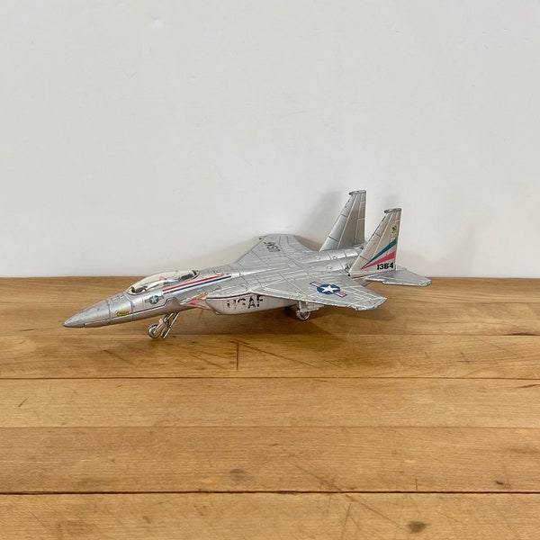 The ERTL Company Silver Die Cast Metal Alloy USAF F-15 Eagle Military Fighter Plane Replica, Small F-15 Die Cast Toy