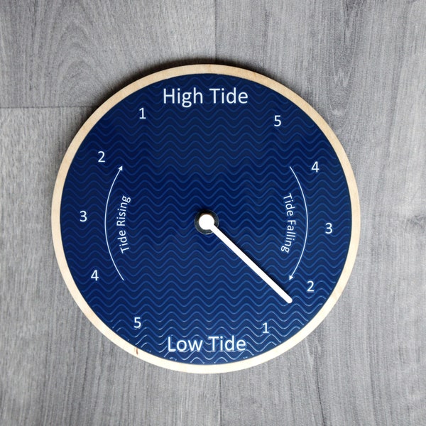Tide Clock. Blue face with subtle embossed wave effect, birch plywood frame. 21cm (8.26 inches) diameter.
