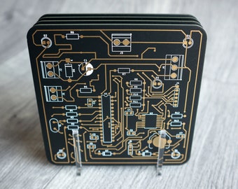 PCB coasters, set of 4 with display stand, black, blue, white or purple printed circuit board. 10 x 10cm x 1.6mm. Gold plated traces.