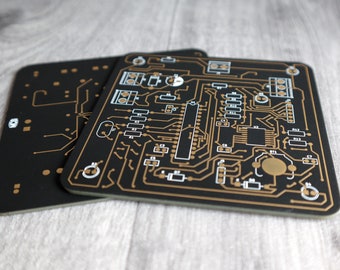 PCB Coasters, set of 2. Available in black, blue, purple or white Printed Circuit Board. Gold plated traces. Approx. 10 x 10cm (3.973")