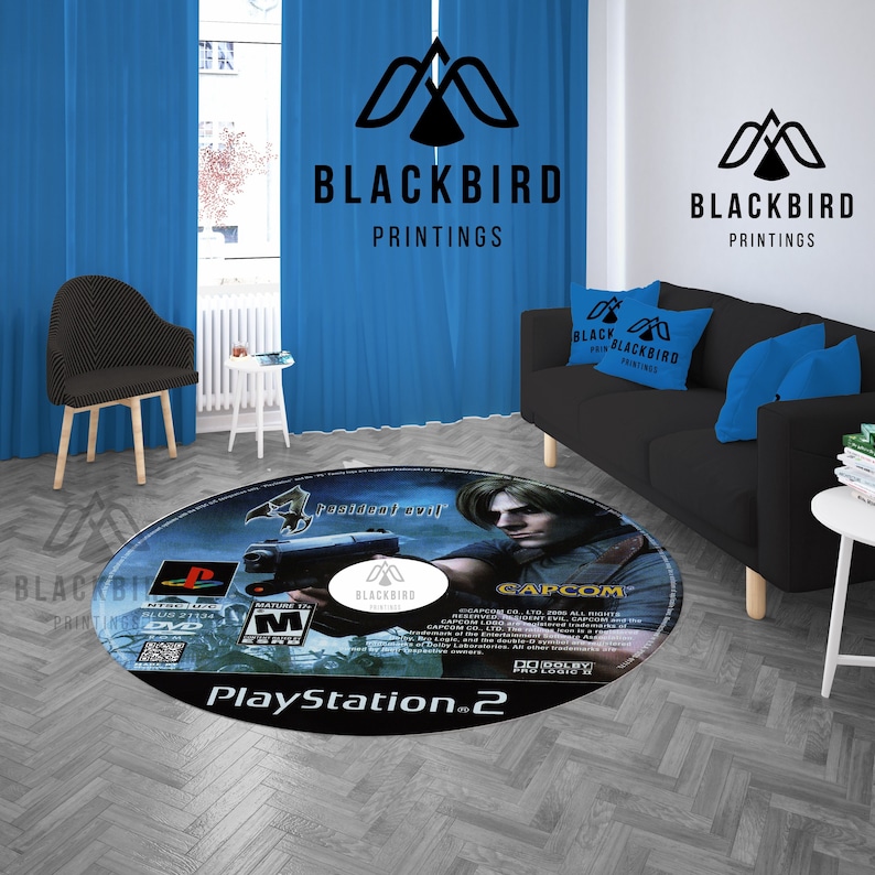 May include: Round area rug featuring the design of a PlayStation 2 game disc. The rug displays the "Resident Evil 4" game cover art, with the PlayStation 2 logo and game details. The rug is on a gray wooden floor.