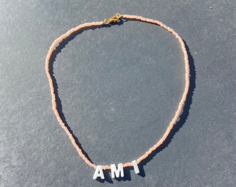 Handmade beaded necklace with mother of pearl initial