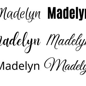 May include: Five different variations of the name "Madelyn" written in different fonts and styles. The name is written in cursive, bold, and a combination of both.