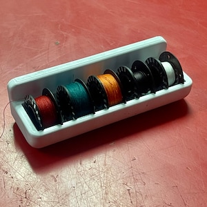Bernina B9 Bobbin Stick on Holder (holds 5 Bobbins)
