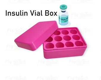 May include: A bright pink Insulin Vial Box with an open lid, revealing circular compartments. A vial of insulin is next to the box. The text "Insulin Vial Box" is displayed in black letters.