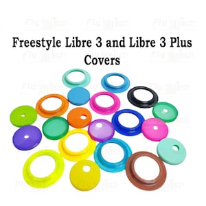 Peut inclure: Une collection de protections colorées pour Freestyle Libre 3 et Libre 3 Plus. Les protections sont de différentes couleurs, notamment vert, bleu, rose, orange et jaune. Le texte "Freestyle Libre 3 and Libre 3 Plus Covers" est affiché en noir en haut de l'image.