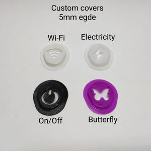 May include: Four custom covers with 5mm edge featuring icons for Wi-Fi, Electricity, On/Off, and a Butterfly. The Wi-Fi and Electricity covers are white, the On/Off cover is black, and the Butterfly cover is purple. Each circular cover displays a cutout symbol.