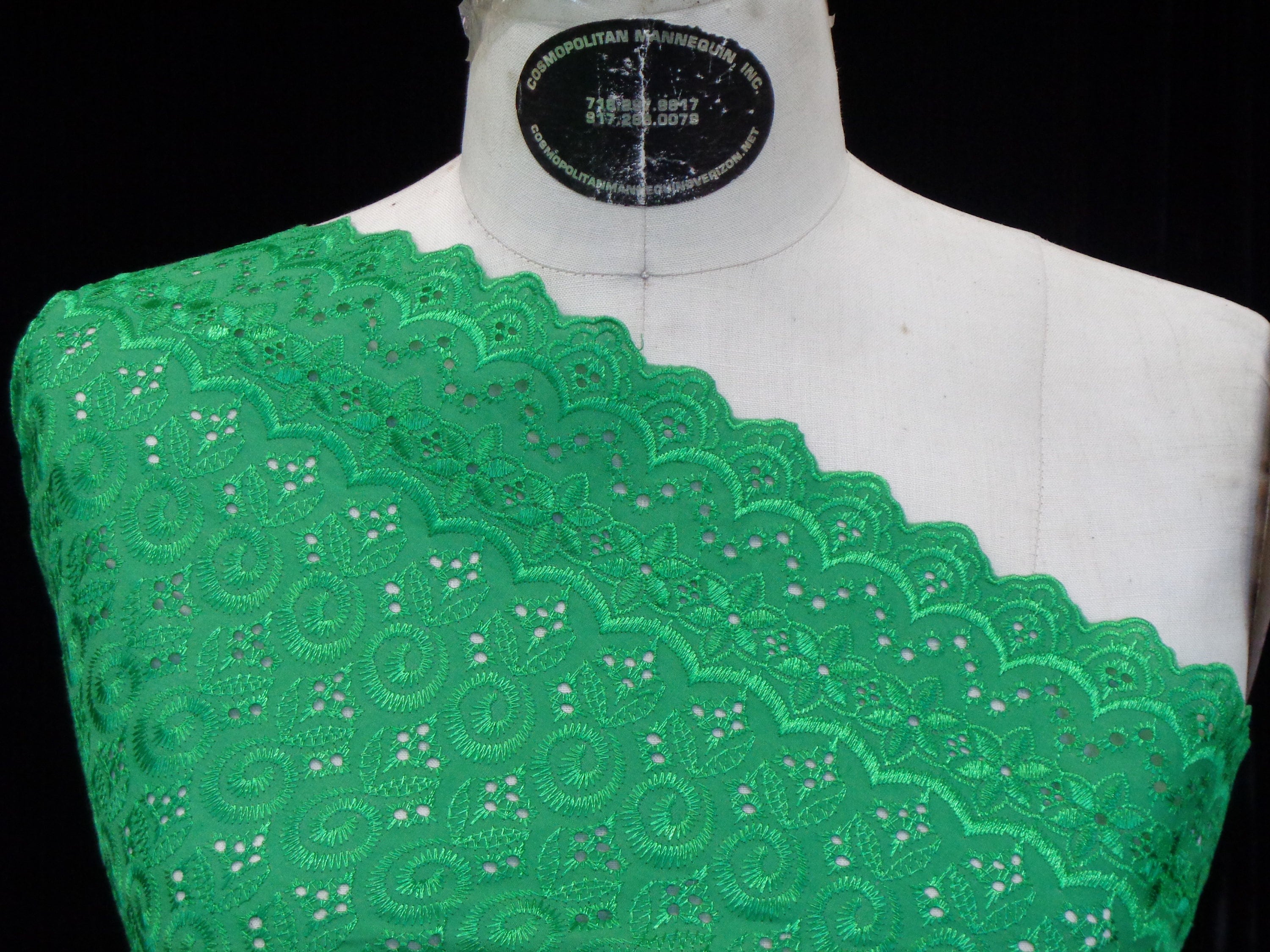 Green corded lace fabric scallop edge both ends rich dark emerald