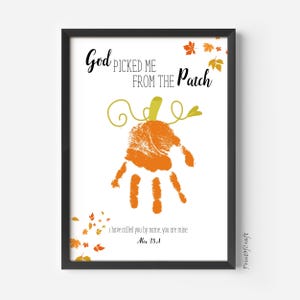 May include: Framed art print featuring a handprint design in the shape of a pumpkin. The text reads "God picked me from the patch" and "I have called you by name, you are mine. Alex 35:1". The artwork includes orange and yellow fall leaves.