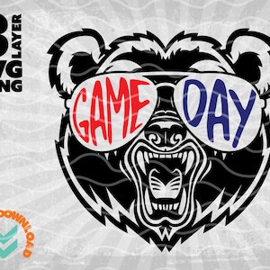 May include: A black bear with a fierce expression wearing sunglasses that say "GAME DAY" in red and blue letters.