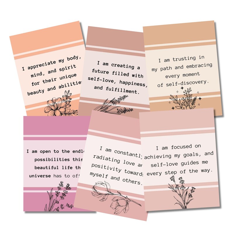 May include: Six pink and peach affirmation cards with black text and floral illustrations. The text on the cards reads: "I appreciate my body, mind, and spirit for their unique beauty and abilities", "I am creating a future filled with self-love, happiness, and fulfillment", "I am trusting in my path and embracing every moment of self-discovery", "I am open to the endless possibilities this beautiful life has to offer", "I am constantly radiating love and positivity toward myself and others", "I am focused on achieving my goals, and self-love guides me every step of the way."