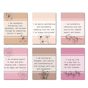 May include: Six pink and brown affirmation cards with floral illustrations and positive messages. The cards feature phrases like "I am constantly attracting love" and "I am turning my thoughts into reality".