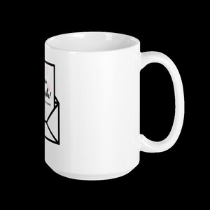 May include: White ceramic mug with a black and white graphic of an envelope with the text "Have a nice day!" and "You are loved. You are worthy. You are enough." in black text.