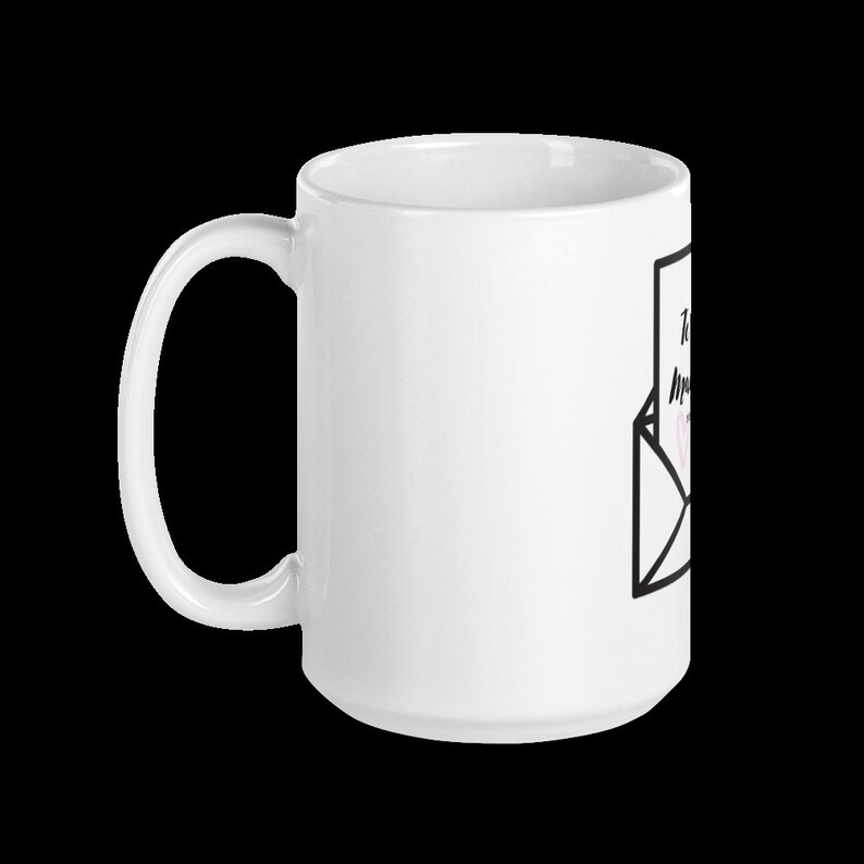 May include: White ceramic mug with a black and white illustration of an envelope with a handwritten note that says "To my amazing mom".