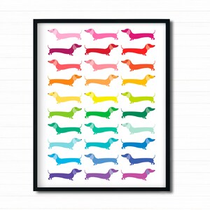May include: A framed print featuring a rainbow of dachshund dogs, each a different color, arranged in a vertical line.