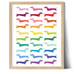 May include: A framed print featuring a rainbow of dachshund dogs, each a different color, arranged in rows.