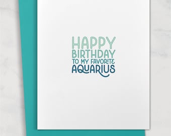 May include: A white card with blue and green text that reads "Happy Birthday to my favorite Aquarius".