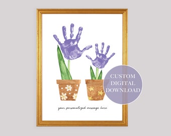 May include: A digital download of a printable art print featuring two handprint flowers in pots. The flowers are purple and the pots are brown with white and yellow accents. The text "CUSTOM DIGITAL DOWNLOAD" is in a purple circle at the bottom right of the image. The text "your personalized message here" is below the flowers.