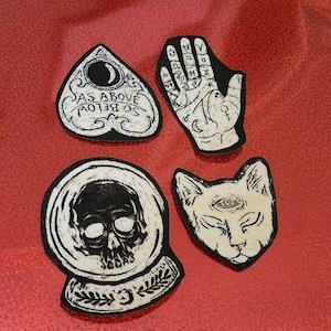 Spooky occult iron on patches.
