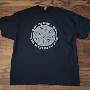 Trippy mushroom Glow in the dark into the forest tshirt. Sizes small-3xl available