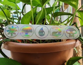 May include: A white sticker with five iridescent holographic circles. Each circle contains a different symbol: a sun, a tree, a teardrop, a wave, and a skull.