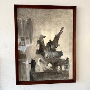 May include: A framed charcoal drawing with a dark brown wooden frame. The artwork features a grayscale depiction of an abstract figure and architectural elements. The drawing has a textured, expressive quality, with visible shading and detail.