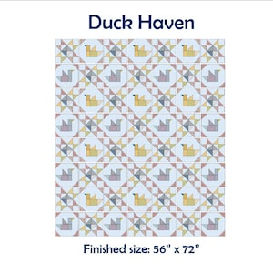 May include: A patchwork quilt titled "Duck Haven" with a repeating pattern of duck and star designs in shades of yellow, blue, and pink. The finished size is 142 cm x 183 cm.