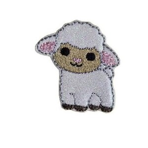 May include: A white lamb with pink ears and brown eyes. The lamb is embroidered with a sparkly white fabric.