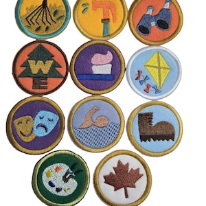 May include: A collection of eleven circular embroidered patches featuring various icons including a rake, hammer, binoculars, compass, toothbrush, kite, theater masks, swimmer, hiking boot, paint palette, and a maple leaf on different colored backgrounds.