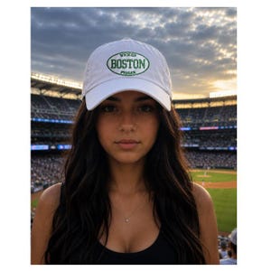 May include: A white baseball cap featuring an oval green embroidered patch on the front. The patch contains the text WICKED in small letters at the top, BOSTON in large bold letters in the center, and PISSAH in small letters at the bottom.