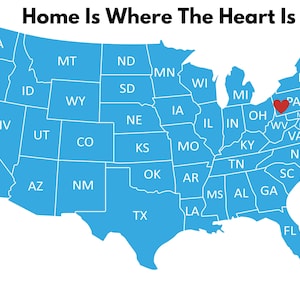 May include: A map of the United States in shades of blue, with each state labeled. A red heart marks a location in Pennsylvania. The text "Home Is Where The Heart Is" is at the top.