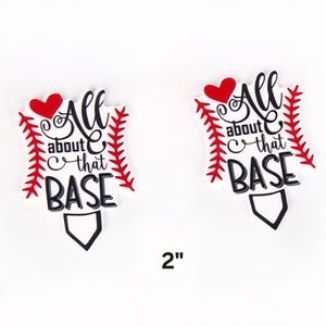 May include: Two baseball-themed decorations with the text "All about that BASE". Each decoration features a red heart, red stitching, and a black home plate shape. The size is 2 inches.