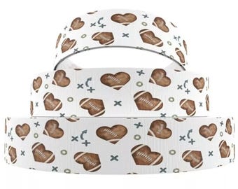 May include: White ribbon with a repeating pattern of brown footballs in heart shapes. The ribbon has a white background with green and blue accents.