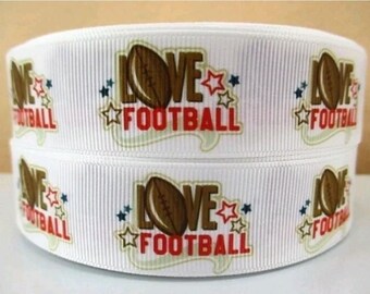 May include: White ribbon with a brown football and the text "Love Football" repeated on the ribbon.
