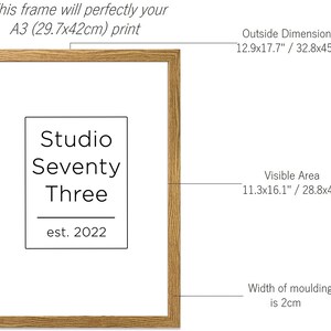 May include: A natural wood frame with a visible area of 11.3x16.1 inches or 28.8x41 centimeters. The frame is 12.9x17.7 inches or 32.8x45 centimeters on the outside. The frame has a width of 2 centimeters and is suitable for an A3 print (29.7x42 centimeters). The frame has a label that reads "Studio Seventy Three est. 2022".