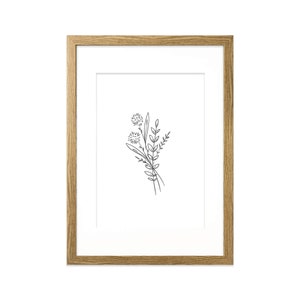 May include: A framed black and white line drawing of a bouquet of flowers with three flower heads and leaves.